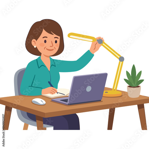 Woman sitting at desk with laptop and adjusting desk lamp