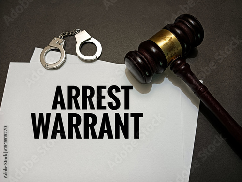 Fotografie Arrest warrant document with judge gavel and handcuffs on desk representing legal authority, criminal justice system, police enforcement, investigation, and law order concept