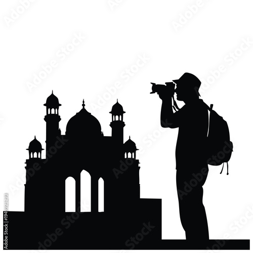 Photographer silhouette taking picture of historic indian temple building