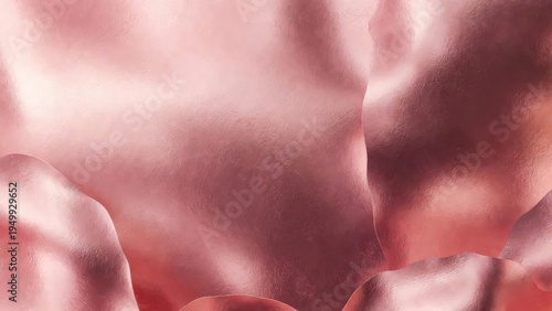 Metallic rose cloth folded with soft highlights in studio setting