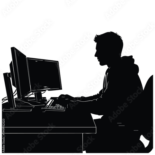 Silhouette of man using dual monitors at desk