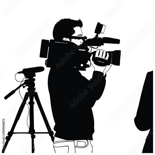 Videographer filming with professional camera silhouette