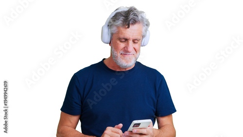 Senior man enjoying music using smartphone and headphones
