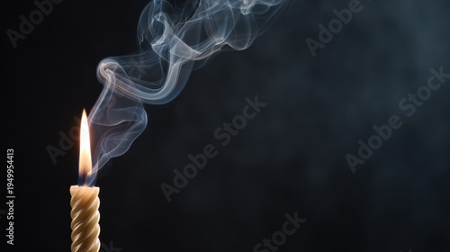 Burning candle with swirling smoke against dark background. Relaxation and meditation concept. Romantic atmosphere or memorial service. Minimalist home decor and calming spiritual light.