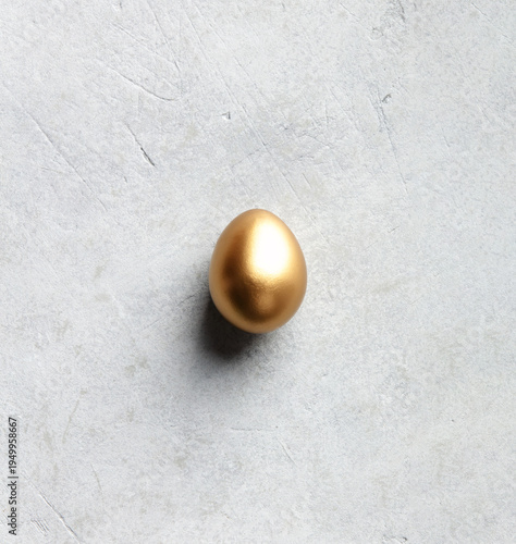 Minimal Luxury Easter Concept with Single Golden Egg