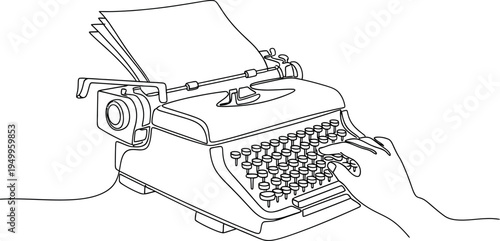 Hand typing on a vintage typewriter