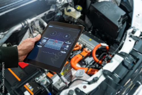 Wallpaper Mural Checking the battery pack of an electric car at a service center Torontodigital.ca