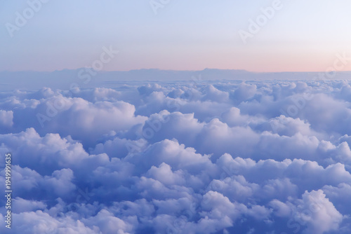 Sunset above the clouds from airplane