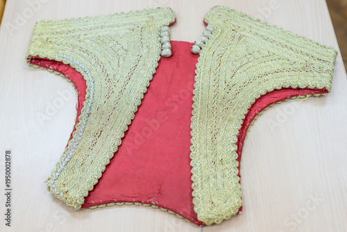 Threads of Tradition. In green and red colors.