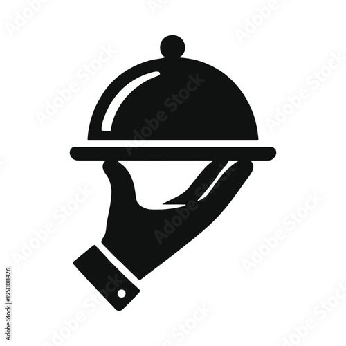 A hand holding a covered serving dish with a cloche lid