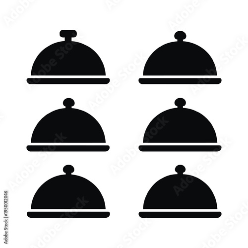 Six black covered serving dishes arranged on a clean white table setting