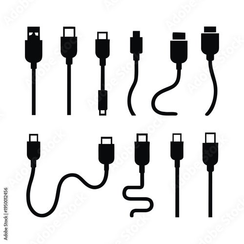 Various electronic device connectors and cables on a plain surface