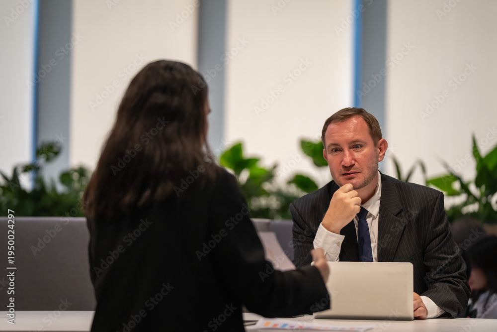 Fototapeta premium Business meeting discussion office environment professional interaction modern workspace focused conversation
