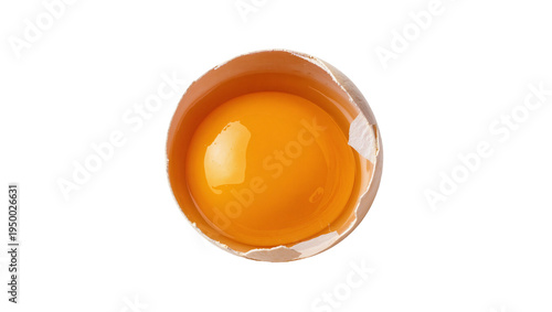 Isolated fresh raw egg yolk in a cracked brown shell, essential ingredient for cooking and baking