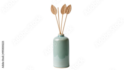 Fotografie Isolated minimalist home decor reed diffuser with decorative leaf-shaped wooden