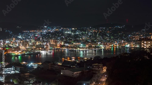 Time lapse video of Nagasaki city view from night to day with zoom out