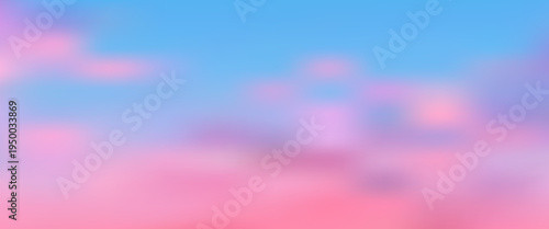 Beautiful sunrise sky featuring soft gradient colors from pink to golden yellow, with wispy clouds creating peaceful morning atmosphere over serene ocean landscape.