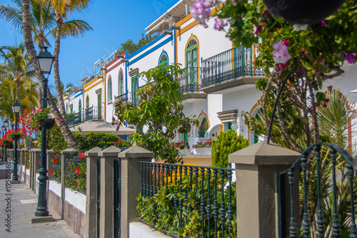 Colorful houses with palm trees and flowers in Puerto de Mogán, Gran Canaria