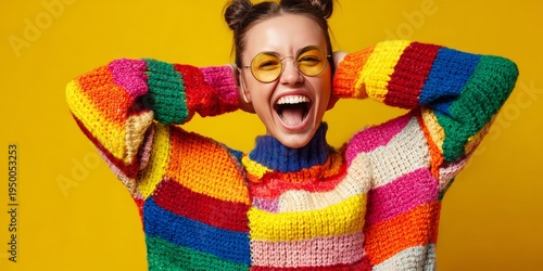 Woman wearing crochet sweater with yellow glasses smiling