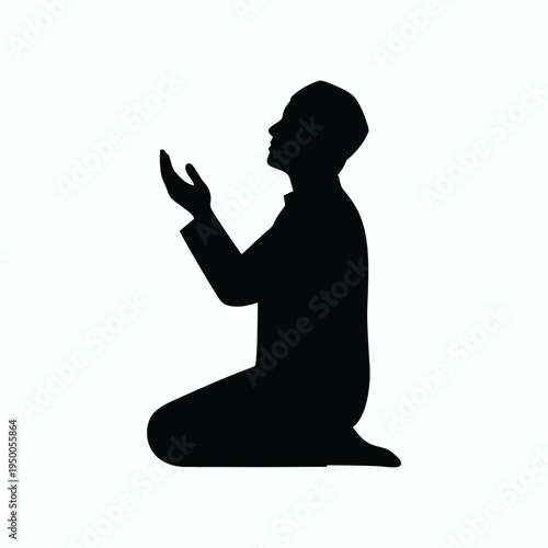 A silhouette of a muslim man in a kneeling position performing prayer with hands raised in devotion