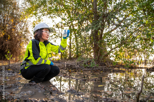 Environmental Engineer Monitoring Water Quality in Outdoor Field Work
