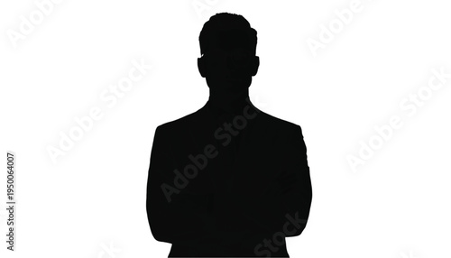 Silhouette of a single businessman wearing a suit standing with arms folded, representing leadership.