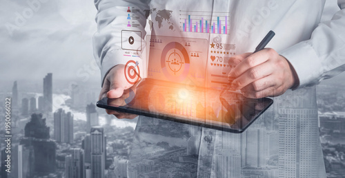 Fotografia A businessman engages with a tablet, featuring layered graphics of charts and maps, capturing the essence of modern data analysis in a dynamic city environment