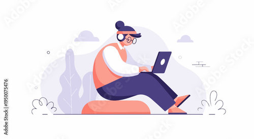 Person with headphones and glasses using a laptop while sitting on a cushion