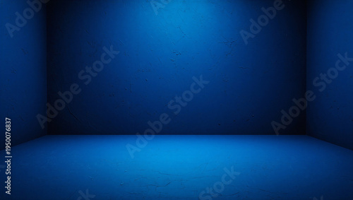 Empty room with blue walls and spotlight on floor