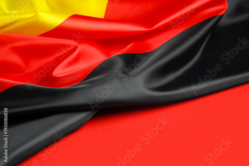 Flag of Germany on red back...