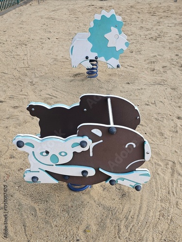 Animal shaped spring rider playground equipment on sand