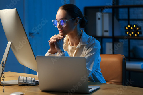 Female trader with eyeglass...