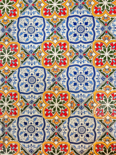 Vibrant Portuguese Azulejo tiles with intricate floral patterns in red, blue, and yellow
