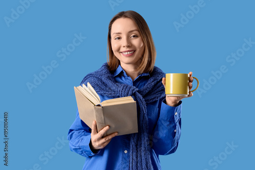 Young woman with cup of tea...