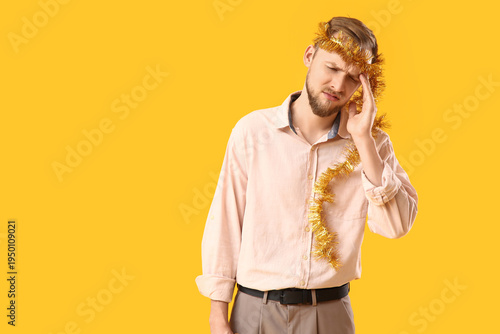 Young man with hangover aft...