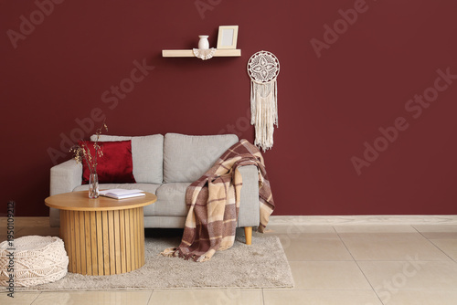 Comfortable sofa, pouf and ...