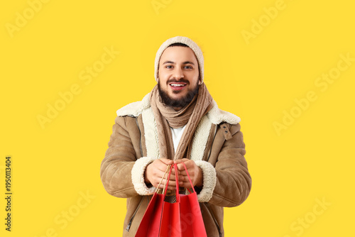 Young man in winter clothes...