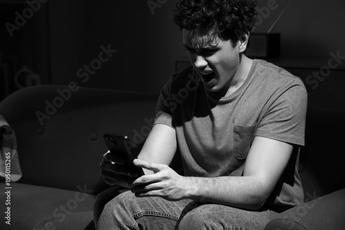 Screaming young man with mo...