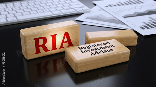 A registered investment advisor's workspace with RIA blocks and financial papers on a desk