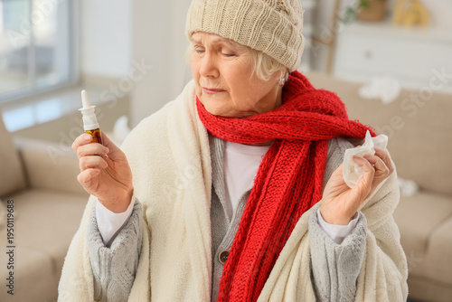 Sick elderly woman with nas...