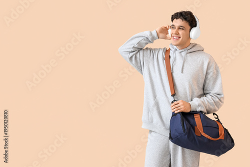 Young man in grey sports su...