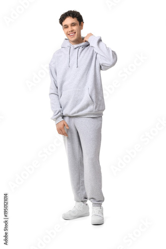 Young man in grey sports su...