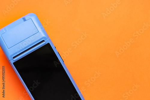 Payment terminal on orange ...