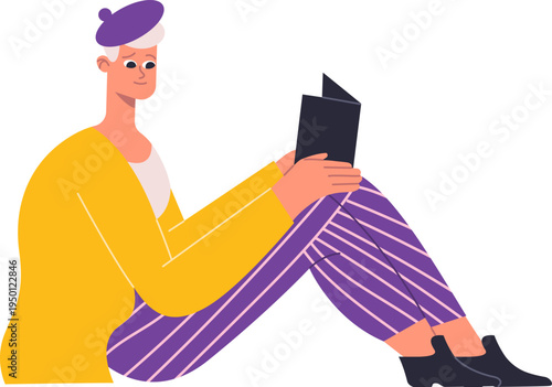 Person reading book sitting relaxing on ground