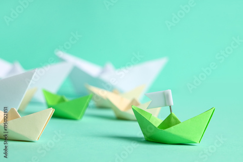 Free Download One origami boat with flag and other ones on color background - GFXLoad
