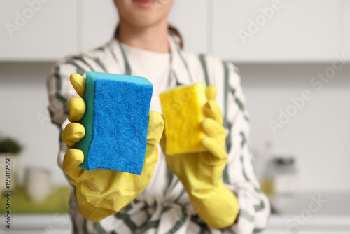 Woman with cleaning sponges...