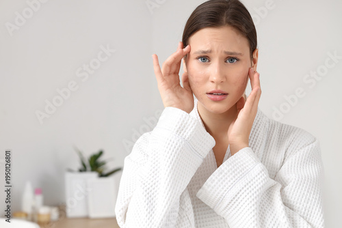 Young woman with acne probl...