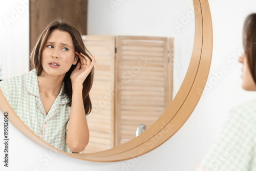 Young woman with acne probl...