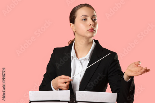 Female conductor with note ...
