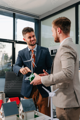 Engineer Teamwork Meeting, with partner on model building at company office working technology, Renewable energy-based green businesses and global warming.